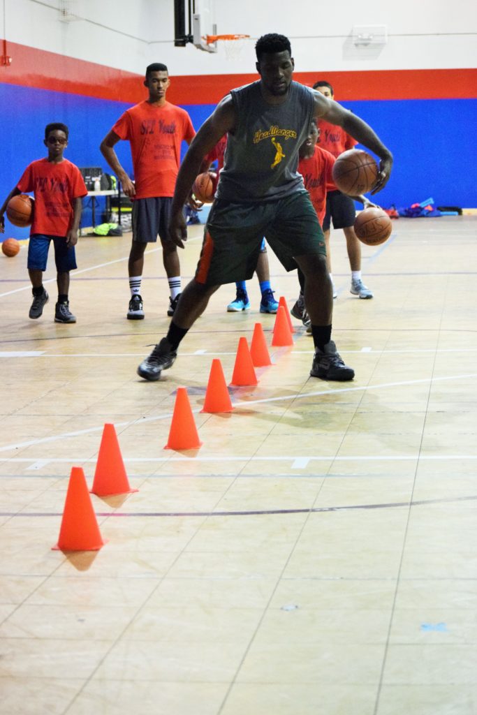 Antonio Hester showing our Campers how to do dribbling drill