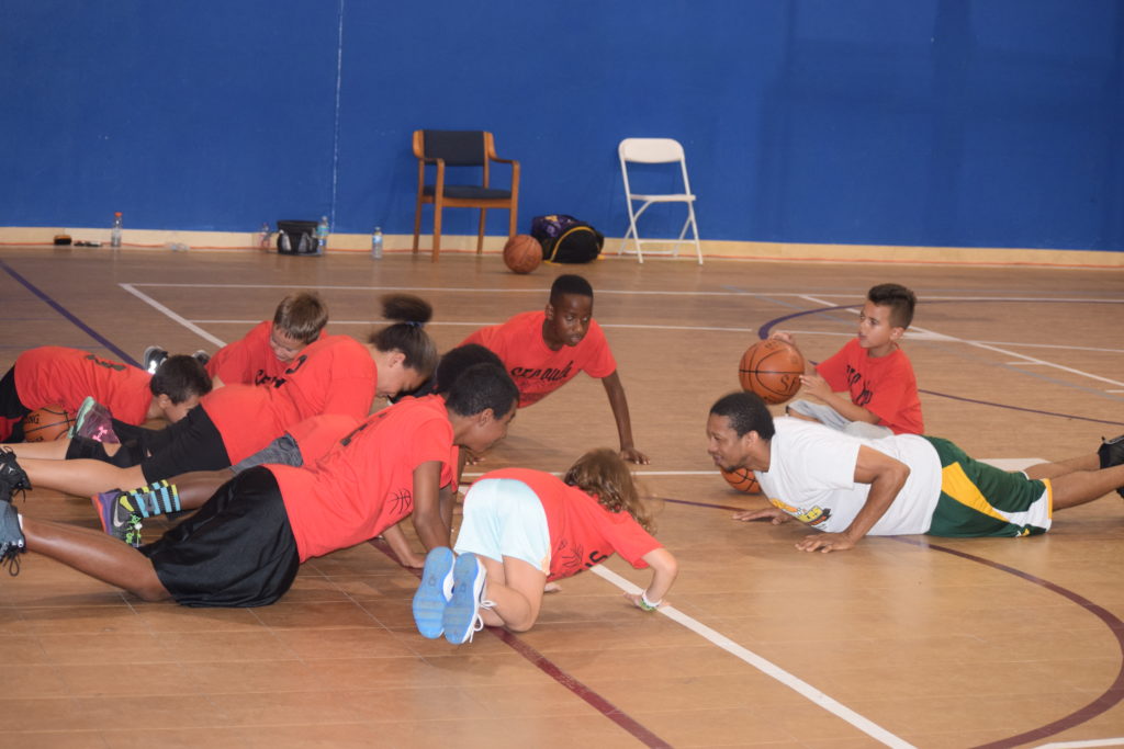 George Gray doing push ups with group that lost the challenge